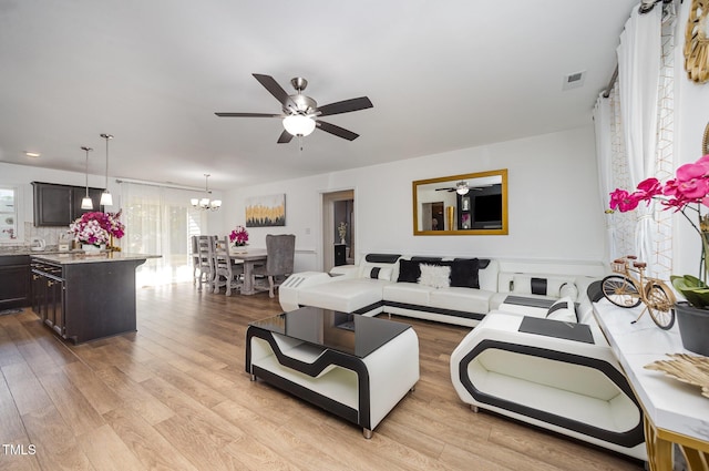 1405 Currituck Ave, Dunn, NC 28334 - living area with a chandelier, a ceiling fan, and light wood finished floors
