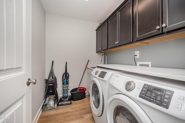 1405 Currituck Ave, Dunn, NC 28334 - laundry area with cabinet space, washer and dryer, and light wood finished floors
