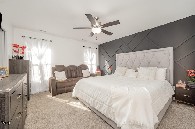 1405 Currituck Ave, Dunn, NC 28334 - bedroom with light colored carpet, a decorative wall, and ceiling fan