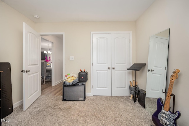 1405 Currituck Ave, Dunn, NC 28334 - bedroom featuring carpet, a closet, and a chandelier