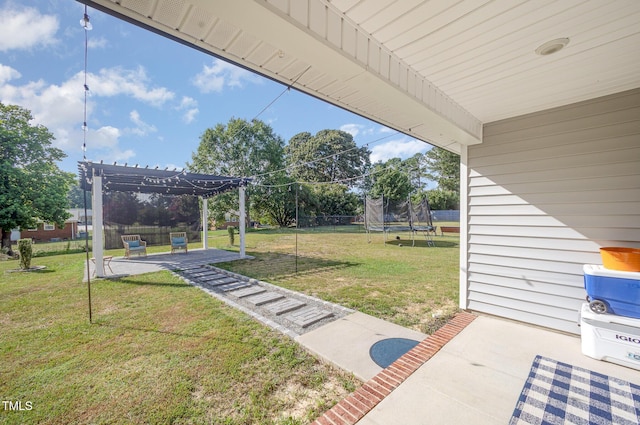 1405 Currituck Ave, Dunn, NC 28334 - view of yard featuring a trampoline, a patio, and a pergola