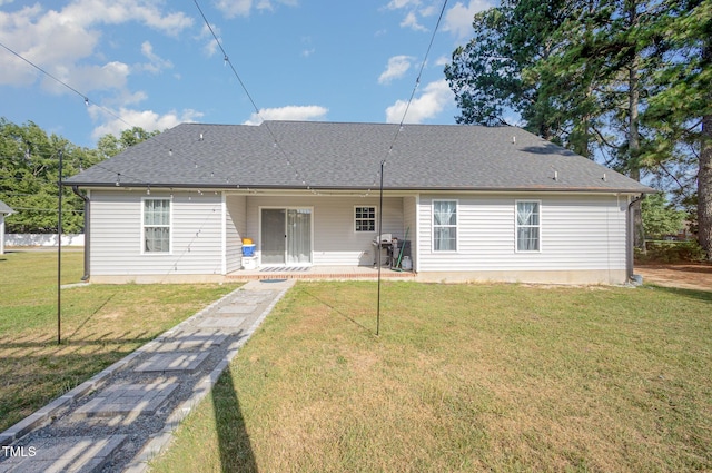 1405 Currituck Ave, Dunn, NC 28334 - back of house featuring a lawn and a shingled roof