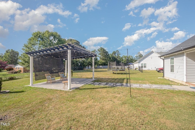1405 Currituck Ave, Dunn, NC 28334 - view of green lawn featuring a trampoline, a pergola, and a patio