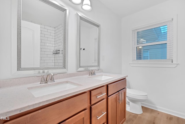 1804 Charles St, Raleigh, NC 27610 - full bathroom with double vanity, wood finished floors, and a shower