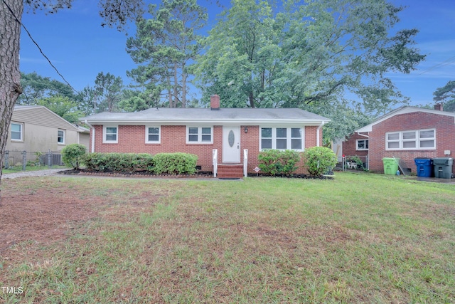 1804 Charles St, Raleigh, NC 27610 - ranch-style home featuring brick siding and a chimney