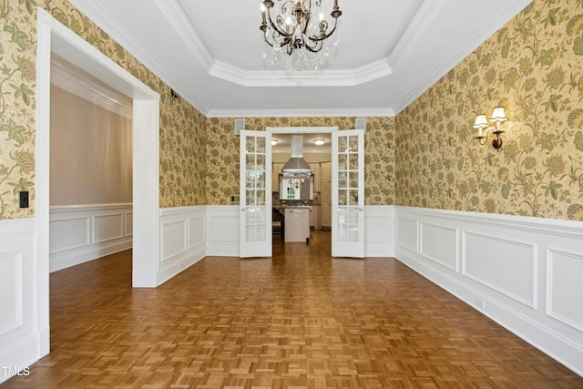 4137 Gardenlake Dr, Raleigh, NC 27612 - spare room with a chandelier, wainscoting, a raised ceiling, and a decorative wall