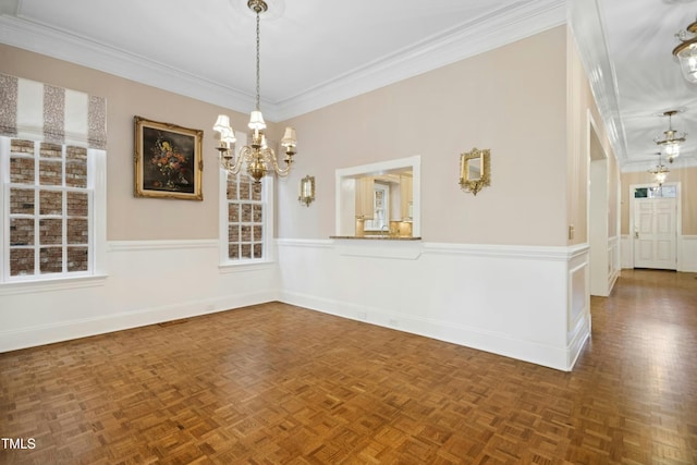 4137 Gardenlake Dr, Raleigh, NC 27612 - unfurnished room with a wainscoted wall, a chandelier, and ornamental molding