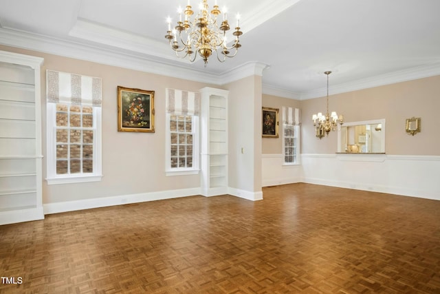 4137 Gardenlake Dr, Raleigh, NC 27612 - unfurnished living room featuring a chandelier, crown molding, and a wainscoted wall
