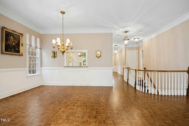 4137 Gardenlake Dr, Raleigh, NC 27612 - empty room with a chandelier, ornamental molding, and a wainscoted wall