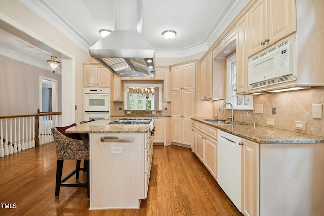 4137 Gardenlake Dr, Raleigh, NC 27612 - kitchen with island range hood, white appliances, a kitchen breakfast bar, ornamental molding, and tasteful backsplash