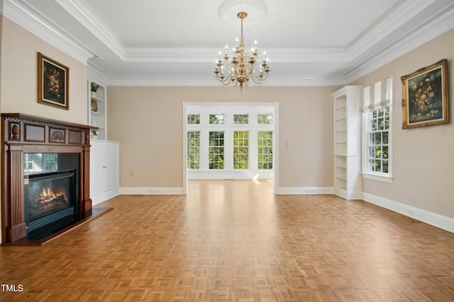4137 Gardenlake Dr, Raleigh, NC 27612 - unfurnished living room with a chandelier, built in features, a fireplace, ornamental molding, and a raised ceiling