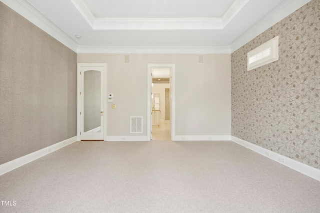4137 Gardenlake Dr, Raleigh, NC 27612 - spare room featuring a tray ceiling, ornamental molding, carpet, and wallpapered walls