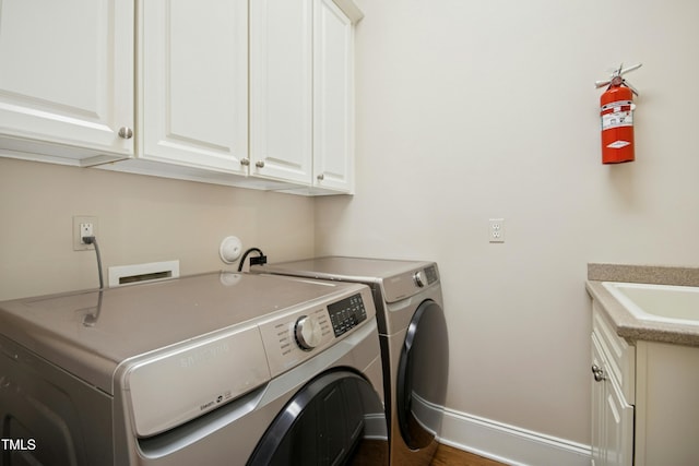 4137 Gardenlake Dr, Raleigh, NC 27612 - laundry room featuring independent washer and dryer and cabinet space