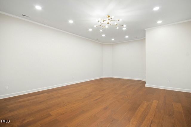 4137 Gardenlake Dr, Raleigh, NC 27612 - spare room featuring crown molding, recessed lighting, a chandelier, and wood finished floors