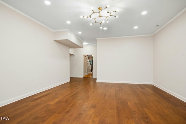 4137 Gardenlake Dr, Raleigh, NC 27612 - spare room featuring ornamental molding, a chandelier, wood finished floors, and recessed lighting