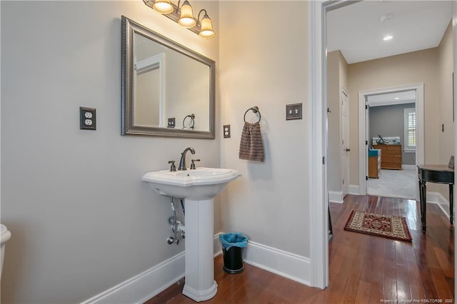 9871 Ramsey St, Linden, NC 28356 - bathroom featuring wood-type flooring and baseboards