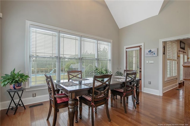 9871 Ramsey St, Linden, NC 28356 - dining space with wood finished floors and high vaulted ceiling