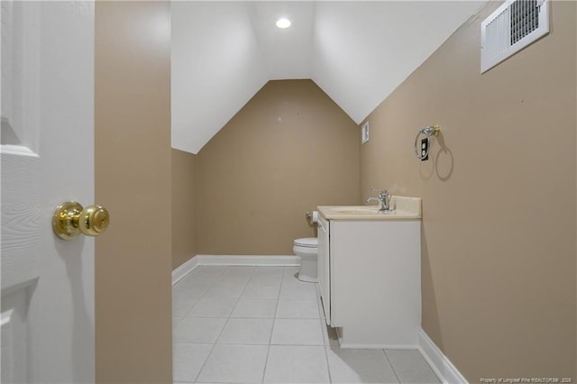9871 Ramsey St, Linden, NC 28356 - bathroom featuring lofted ceiling, vanity, and tile patterned flooring