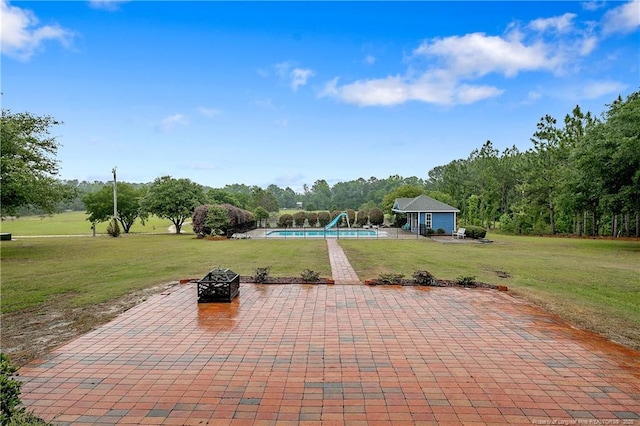 9871 Ramsey St, Linden, NC 28356 - view of patio / terrace with an outdoor pool and a fire pit
