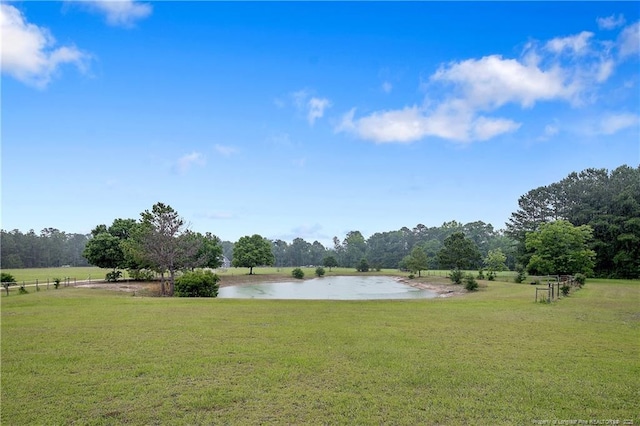 9871 Ramsey St, Linden, NC 28356 - view of green lawn featuring a water view