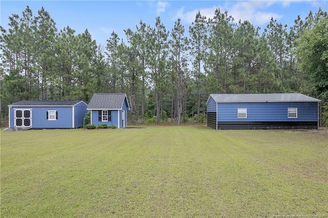9871 Ramsey St, Linden, NC 28356 - view of grassy yard featuring a shed and view of scattered trees