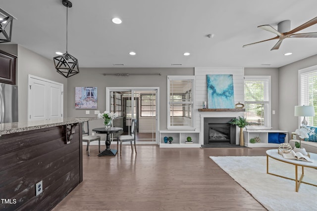 113 Willow View Ln, Apex, NC 27539 - living area with ceiling fan, wood finished floors, recessed lighting, and a fireplace with flush hearth