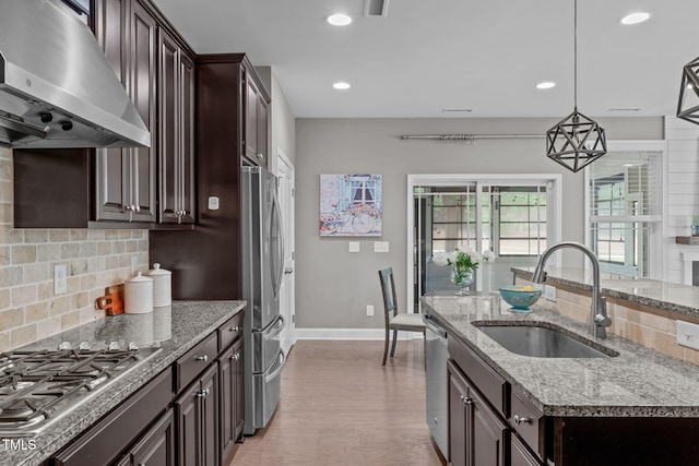 113 Willow View Ln, Apex, NC 27539 - kitchen with exhaust hood, appliances with stainless steel finishes, tasteful backsplash, dark brown cabinets, and recessed lighting