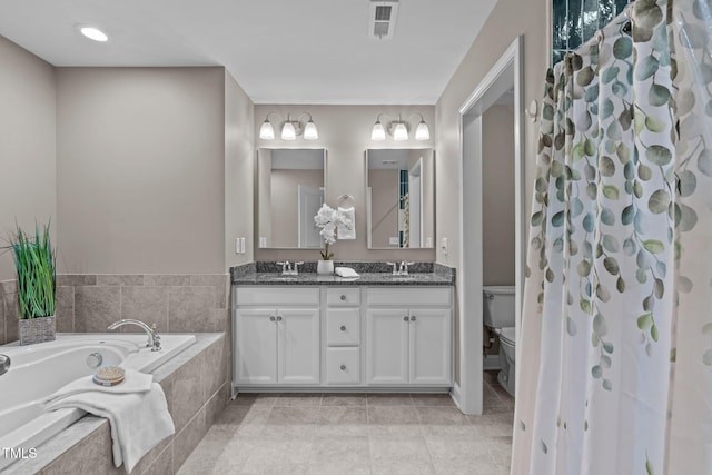 113 Willow View Ln, Apex, NC 27539 - bathroom with double vanity, a garden tub, and tile patterned flooring