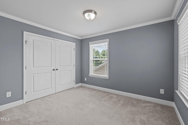 113 Willow View Ln, Apex, NC 27539 - unfurnished bedroom featuring ornamental molding, carpet floors, and a closet
