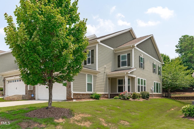 113 Willow View Ln, Apex, NC 27539 - view of front of house with a front lawn, concrete driveway, stone siding, and a garage