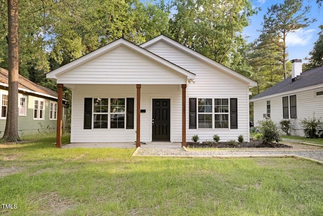 1307 S 14th St, Lillington, NC 27546 - view of front facade featuring a front lawn and a porch