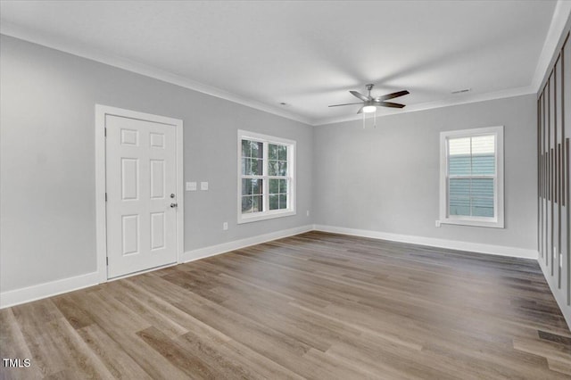 1307 S 14th St, Lillington, NC 27546 - unfurnished room featuring a ceiling fan, healthy amount of natural light, ornamental molding, and wood finished floors