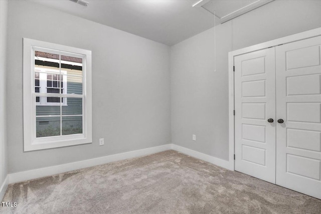 1307 S 14th St, Lillington, NC 27546 - spare room featuring attic access and carpet floors