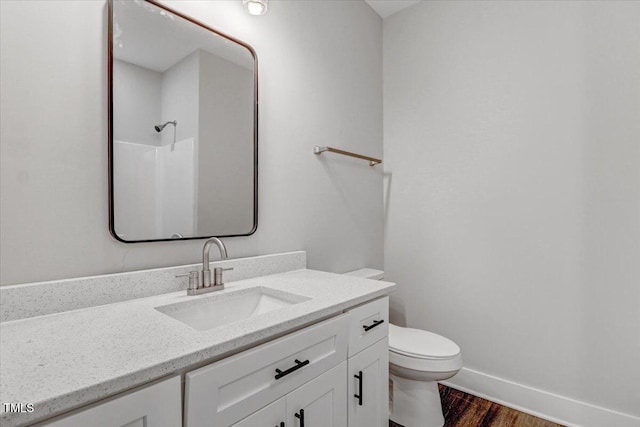 1307 S 14th St, Lillington, NC 27546 - bathroom featuring wood finished floors, vanity, and a shower