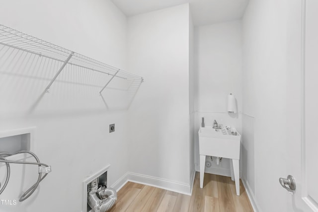 6109 Oak Passage Dr, Raleigh, NC 27603 - washroom featuring light wood-style floors, hookup for an electric dryer, and hookup for a washing machine