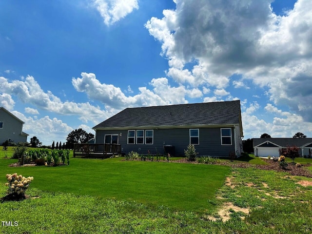 6109 Oak Passage Dr, Raleigh, NC 27603 - back of property featuring a yard and a wooden deck