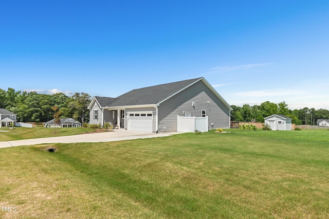 6109 Oak Passage Dr, Raleigh, NC 27603 - view of home's exterior with driveway, an attached garage, and a storage unit