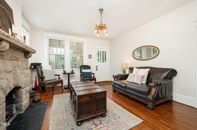 513 Cutler St, Raleigh, NC 27603 - living area featuring a fireplace, dark wood finished floors, and a chandelier