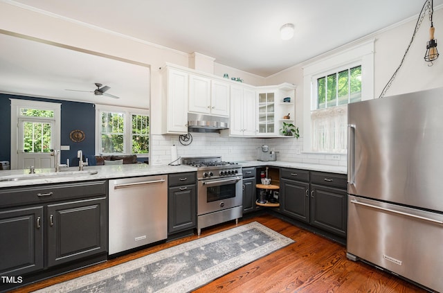 513 Cutler St, Raleigh, NC 27603 - kitchen with stainless steel appliances, under cabinet range hood, white cabinets, gray cabinets, and dark wood-style flooring