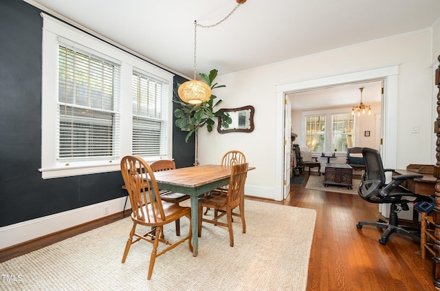 513 Cutler St, Raleigh, NC 27603 - dining area with wood finished floors, ornamental molding, a chandelier, and an office area