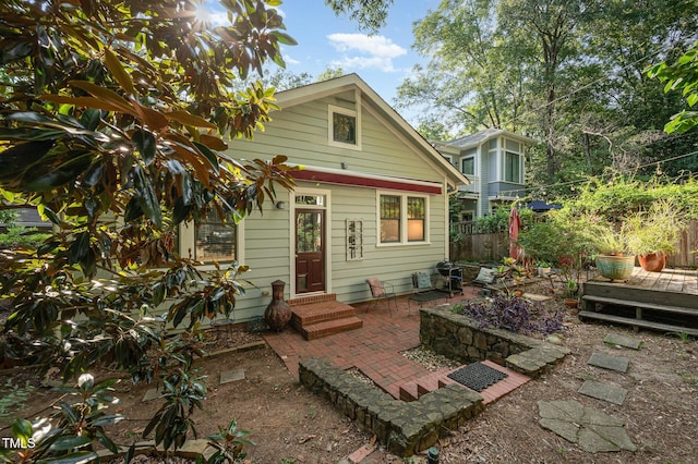 513 Cutler St, Raleigh, NC 27603 - rear view of house with entry steps and a patio