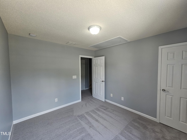 121 Brentfield Loop, Morrisville, NC 27560 - unfurnished room featuring attic access, carpet, a textured ceiling, and a smoke detector