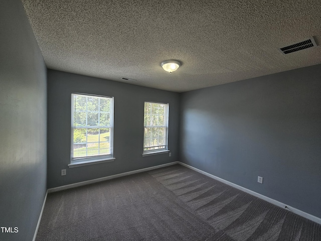 121 Brentfield Loop, Morrisville, NC 27560 - empty room with dark colored carpet and a textured ceiling