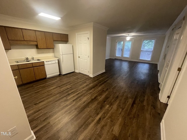 3603 Helix Ct Unit 102, Raleigh, NC 27606 - kitchen with white appliances, dark wood-type flooring, light countertops, crown molding, and brown cabinetry