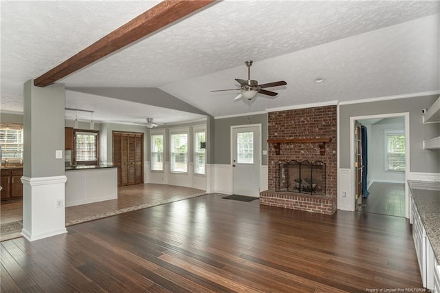 5621 Monks Walk Ct, Fayetteville, NC 28311 - unfurnished living room with ceiling fan, dark wood-style floors, a textured ceiling, a fireplace, and vaulted ceiling