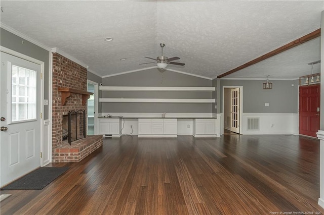5621 Monks Walk Ct, Fayetteville, NC 28311 - unfurnished living room featuring wood finished floors, ceiling fan, a fireplace, ornamental molding, and a textured ceiling