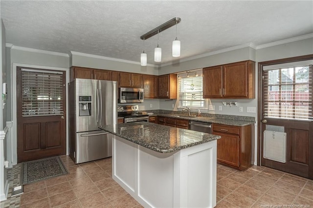 5621 Monks Walk Ct, Fayetteville, NC 28311 - kitchen featuring stainless steel appliances, dark stone countertops, a kitchen island, a textured ceiling, and pendant lighting