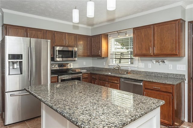 5621 Monks Walk Ct, Fayetteville, NC 28311 - kitchen with stainless steel appliances, dark stone counters, a textured ceiling, a kitchen island, and hanging light fixtures