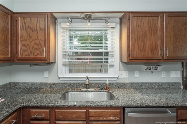 5621 Monks Walk Ct, Fayetteville, NC 28311 - kitchen featuring dishwasher, dark stone counters, and brown cabinets
