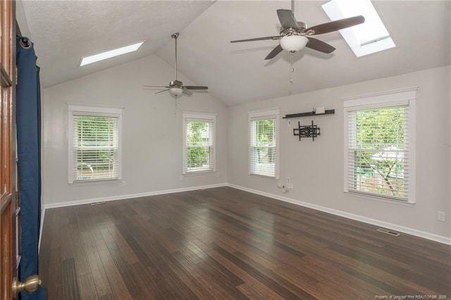 5621 Monks Walk Ct, Fayetteville, NC 28311 - spare room with a skylight, a ceiling fan, lofted ceiling, and dark wood-style floors